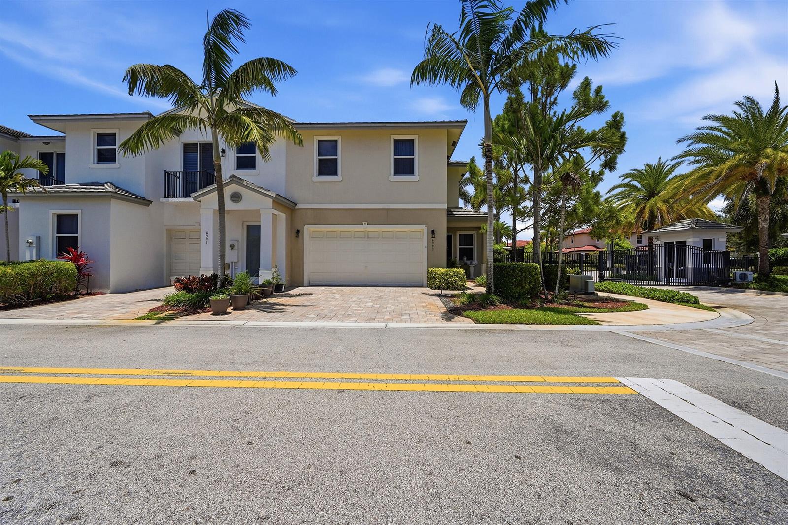 A bedroom with a bed, a desk, a bookshelf, and a ceiling fan — 6993 Pines Circle, Coconut Creek FL 33073, COCONUT CREEK, FL