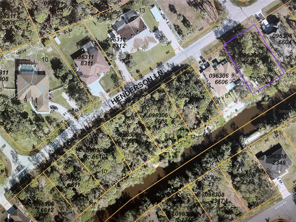 This is an aerial map showing residential property lot lines and houses along a street — LOT 5 HENDERSON LANE, NORTH PORT, FL