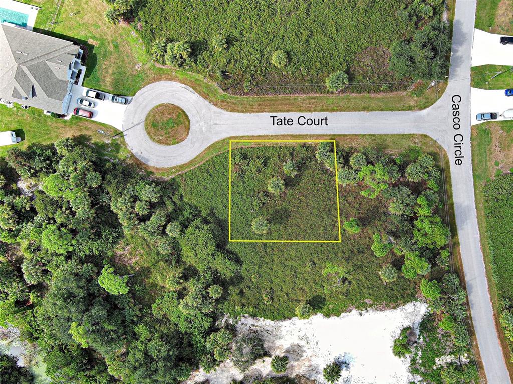 This aerial view shows a vacant, rectangular residential lot located at the end of a cul-de-sac — TATE COURT, NORTH PORT, FL
