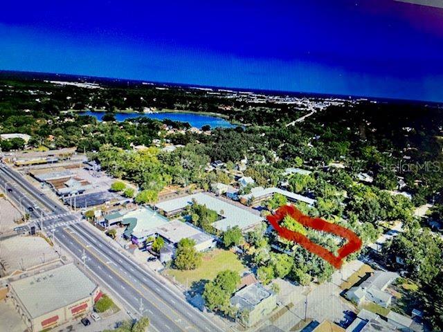 An aerial view shows a commercial property with a red outline highlighting a specific area — 726 CORDOVA DRIVE, ORLANDO, FL