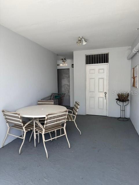 A covered patio features a round table with four chairs and a white door — 711 UNION STREET UNIT 8 N, SAN JUAN, PR