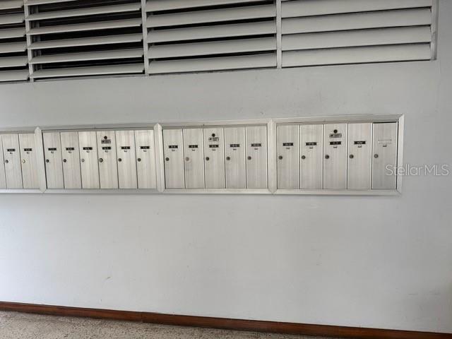A wall of metal mailboxes is mounted below horizontal ventilation slats — 711 UNION STREET UNIT 8 N, SAN JUAN, PR