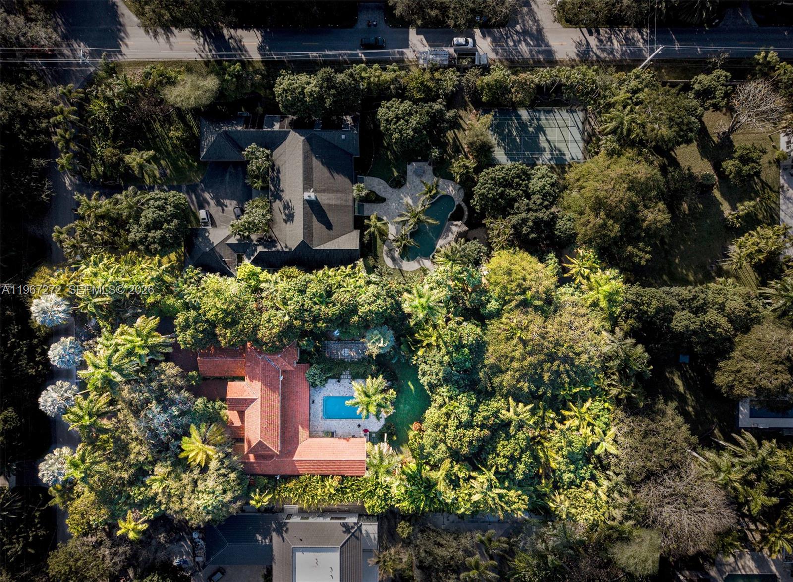 An aerial view shows two large residential properties with swimming pools and lush landscaping — 4867 SW 82nd St, Miami FL 33143, MIAMI, FL