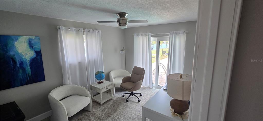 A bright entryway features a white front door, light tile flooring, and a console table — 6351 3RD PALM POINT, ST PETE BEACH, FL