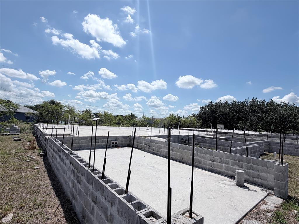 A concrete block foundation and slab for a new house construction project — 2930 MAGDALINA DRIVE, PUNTA GORDA, FL