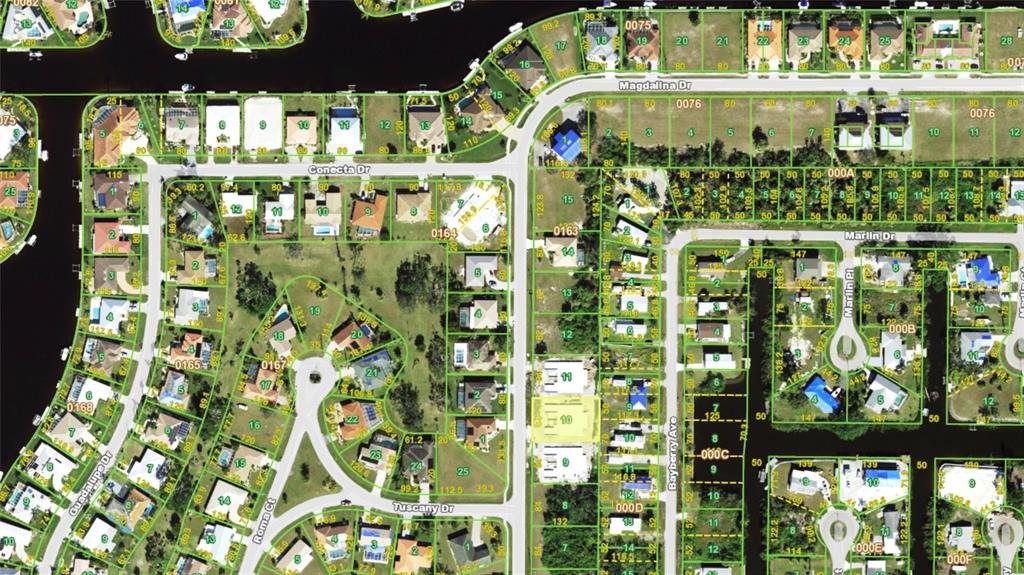 This is an aerial map showing residential lots, streets, and waterways in a suburban neighborhood — 2930 MAGDALINA DRIVE, PUNTA GORDA, FL
