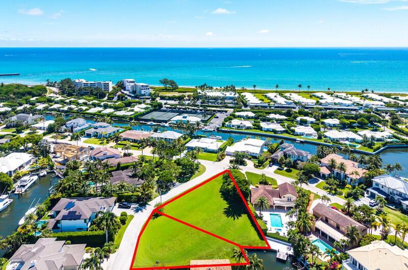 An aerial view shows a vacant, triangular-shaped lot outlined in red within a residential neighborhood — 103 Bonito Drive, Ocean Ridge FL 33435, OCEAN RIDGE, FL