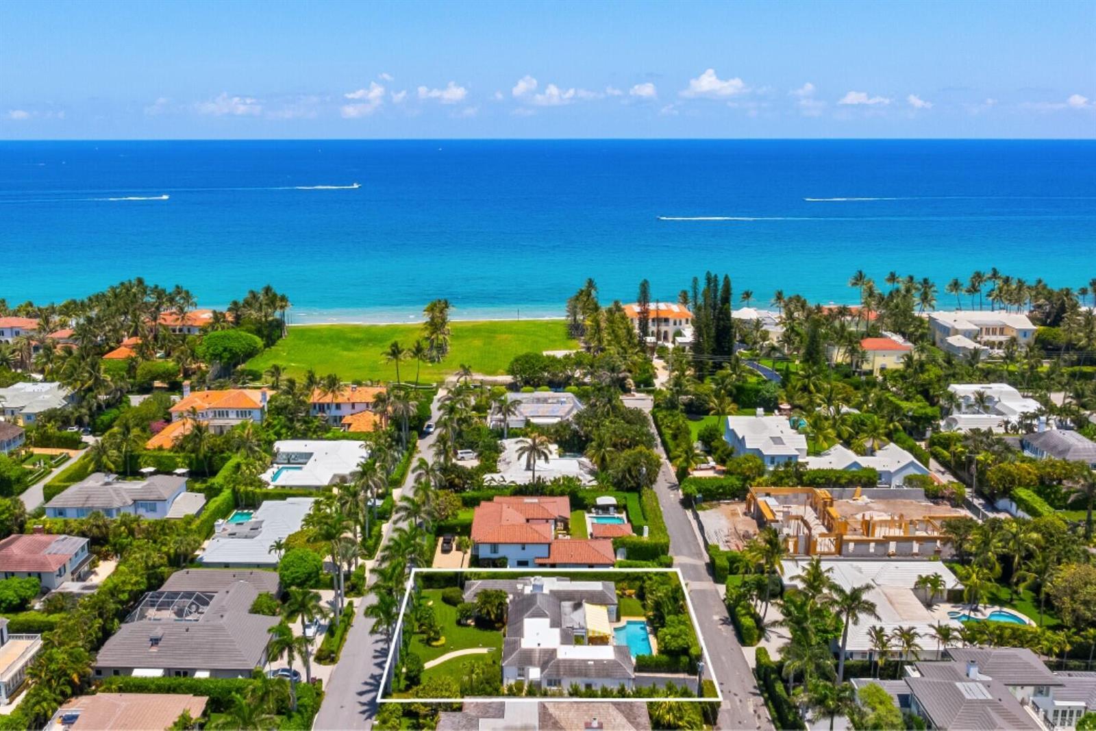 An aerial view shows a residential property with a pool near a sandy beach — 226 List Road, Palm Beach FL 33480, PALM BEACH, FL