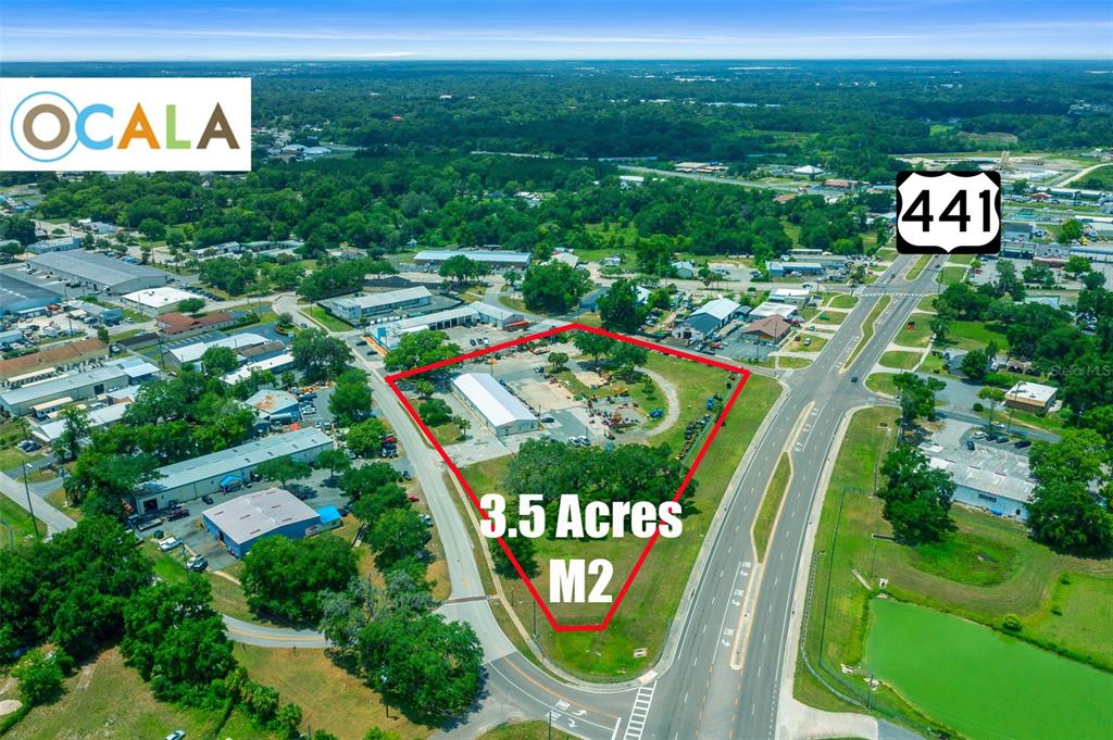 This aerial view shows a 3.5-acre parcel of land outlined in red near a highway — 1904 NE JACKSONVILLE ROAD, OCALA, FL