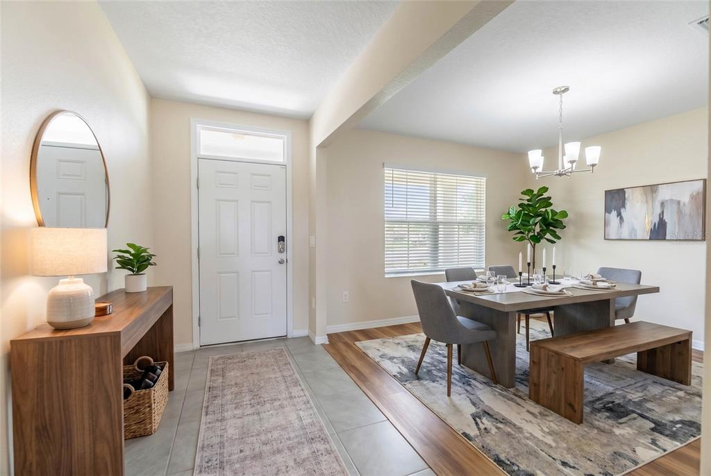 This living room features a gray sectional sofa, a wooden coffee table, and a television console — 17448 HARVEST MOON WAY, BRADENTON, FL