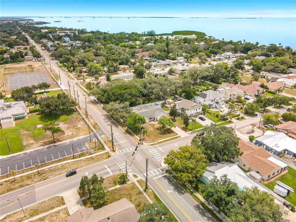 An aerial view shows a residential neighborhood near a large body of water — 1601 GULF ROAD, TARPON SPRINGS, FL