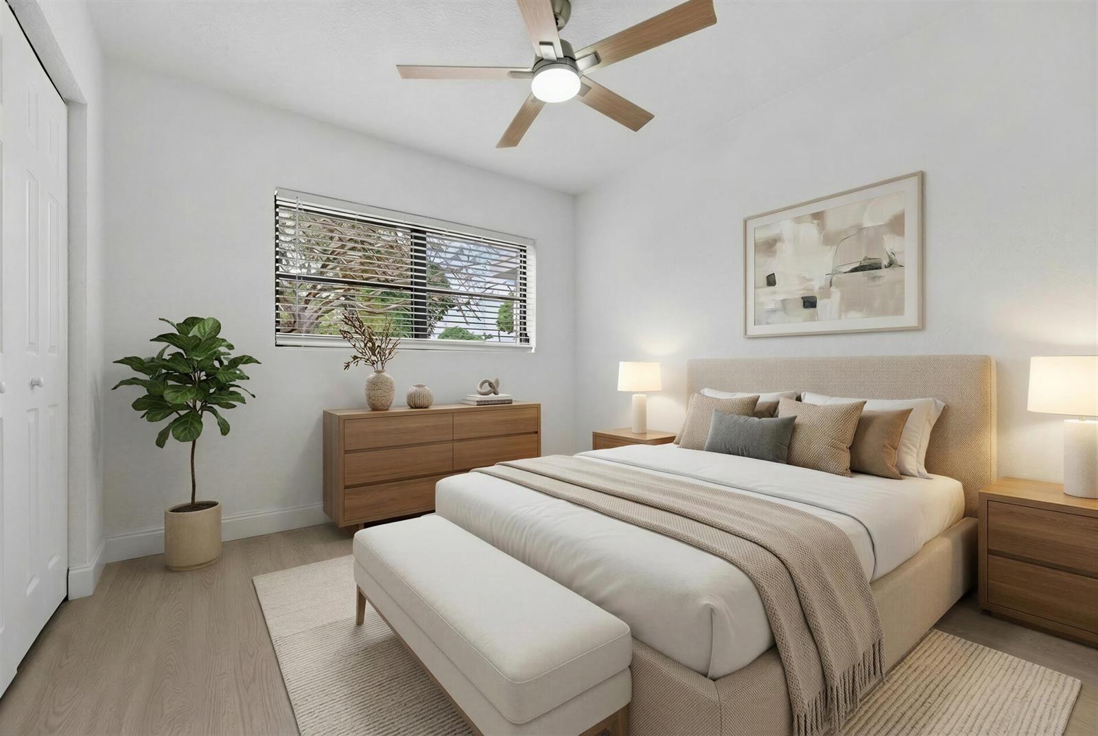A bedroom features a bed with a beige headboard, a wooden dresser, and a ceiling fan — 1048 SW 1st Terrace, Pompano Beach FL 33060, POMPANO BEACH, FL