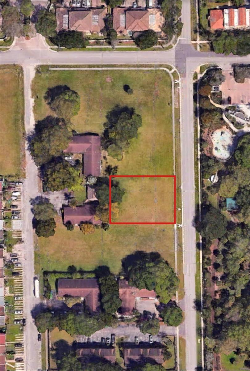This aerial view shows a vacant rectangular lot highlighted in red within a residential neighborhood — 3701 NW 90th Terrace, Sunrise FL 33351, SUNRISE, FL