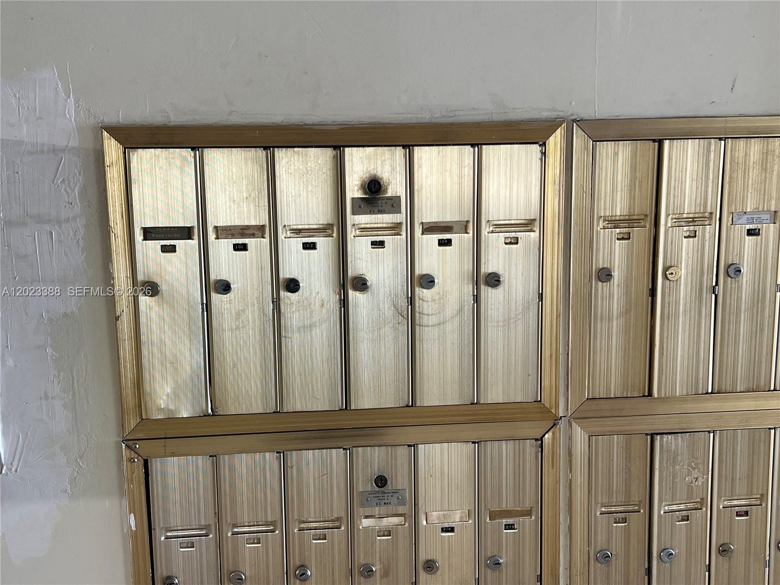 A wall-mounted unit of metallic mailboxes with individual locks and identification numbers — 2060 NW 48th Ter # 103, Lauderhill FL 33313, LAUDERHILL, FL