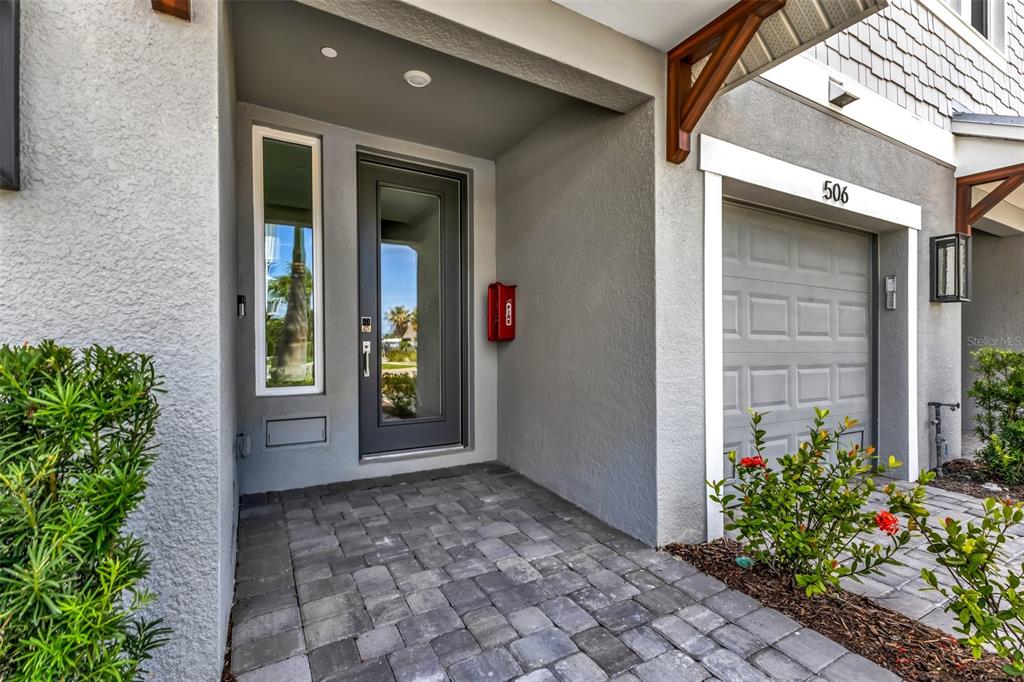 A front entrance features a gray door, a side window, and a red mailbox — 1617 SEAHAVEN DRIVE UNIT 505, PUNTA GORDA, FL