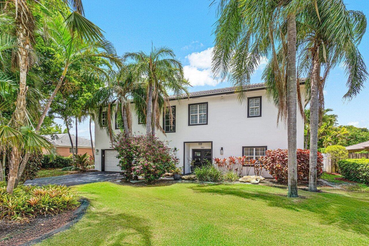 A two-story white house with dark trim, a front lawn, and several palm trees — 783 Toledo Drive, Boca Raton FL 33432, BOCA RATON, FL