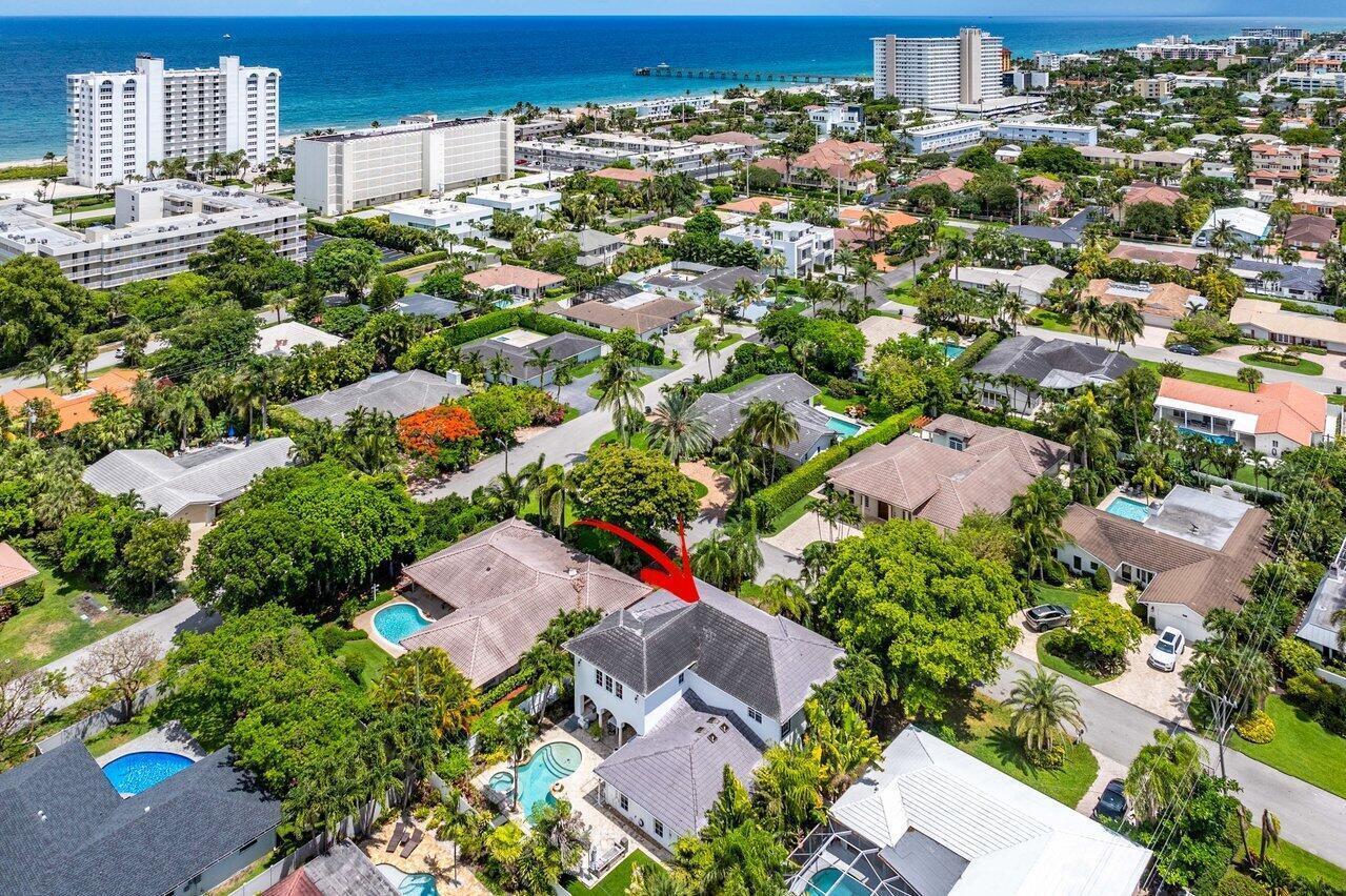 An aerial view of a two-story house with a pool in a residential coastal neighborhood — 783 Toledo Drive, Boca Raton FL 33432, BOCA RATON, FL