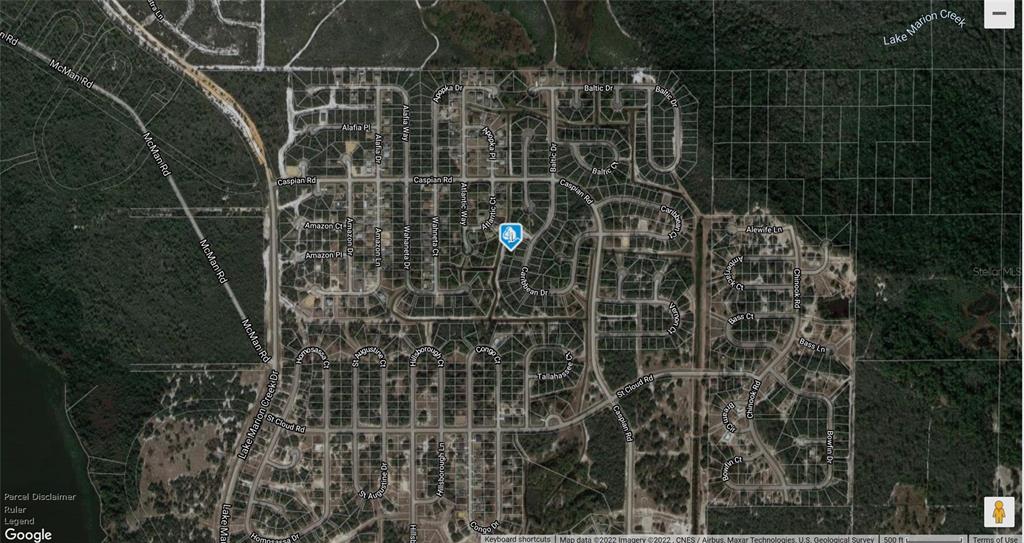 This is an aerial map view of a residential neighborhood with streets and wooded areas — 1248 CARIBBEAN DRIVE, POINCIANA, FL