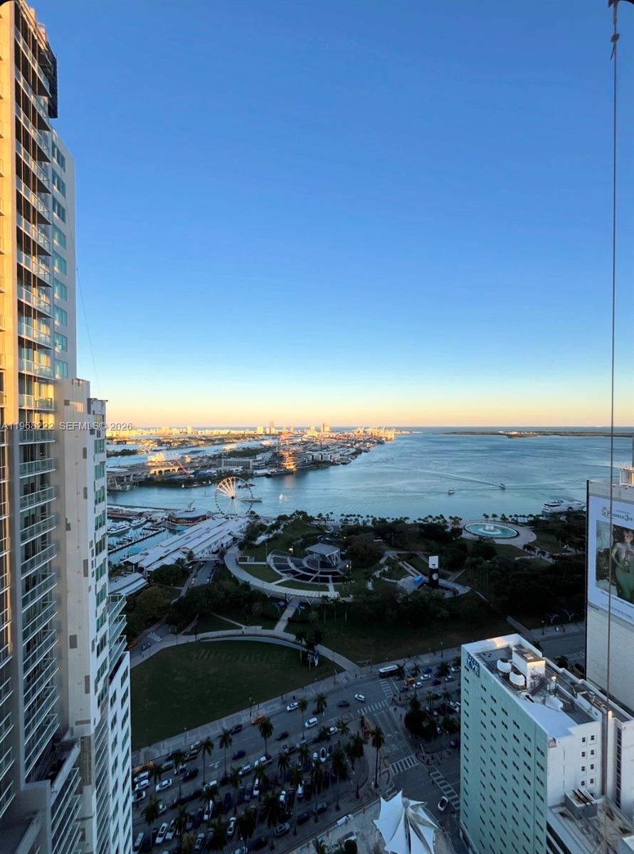 High-angle view of a waterfront park, a Ferris wheel, and a harbor from a balcony — 253 NE 2nd St # 3903, Miami FL 33132, MIAMI, FL