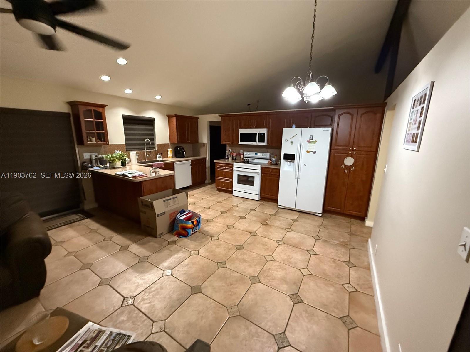 A narrow closet features white louvered doors and four white wire storage shelves — 9422 SW 127th Ave, Miami FL 33186, MIAMI, FL