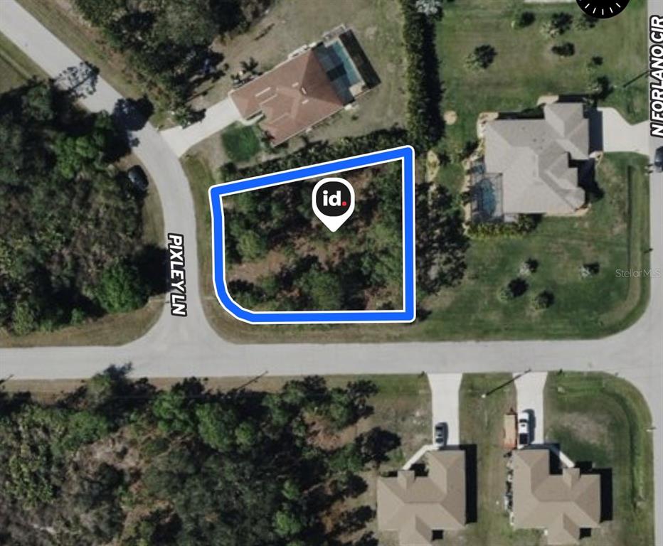 This aerial map shows a vacant, wooded residential lot outlined in blue on a corner — SCHOEN STREET, NORTH PORT, FL
