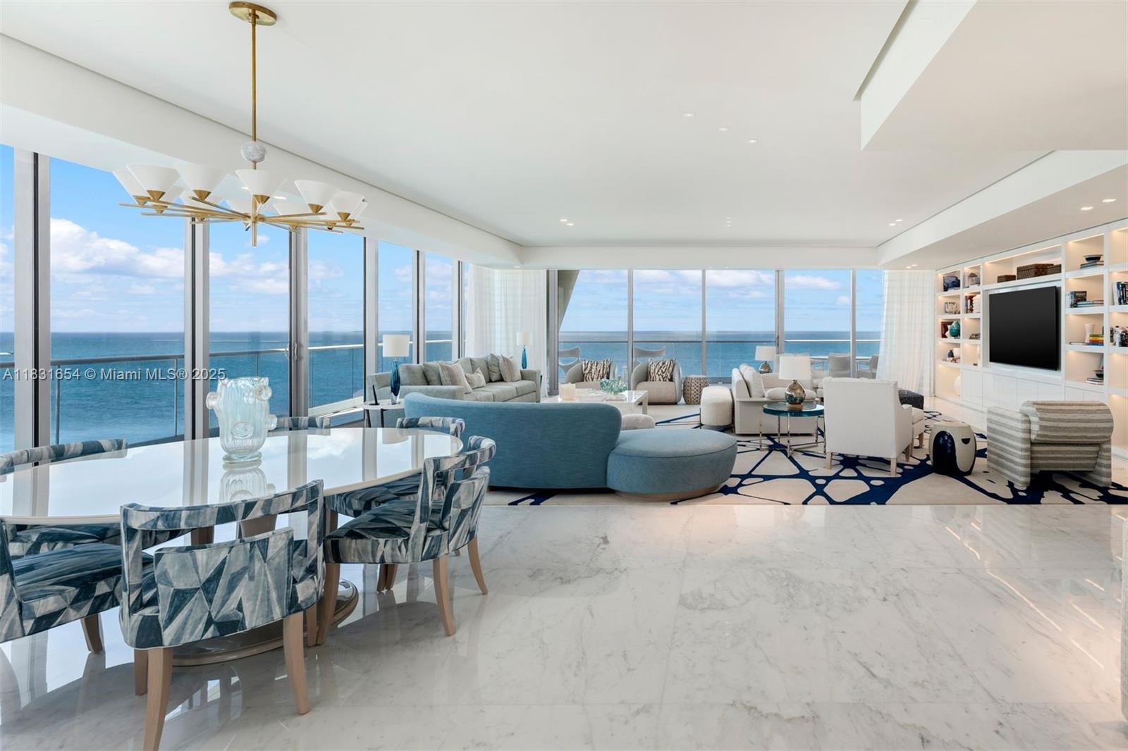 A spacious, open-concept living and dining area features marble floors, floor-to-ceiling windows, and ocean views — 9349 Collins Ave # 1101, Surfside FL 33154, SURFSIDE, FL