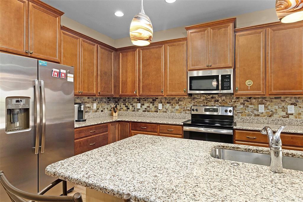 A tiled foyer leads to a bedroom, a living area, and an outdoor patio space — 677 VIA CORSO COURT, KISSIMMEE, FL
