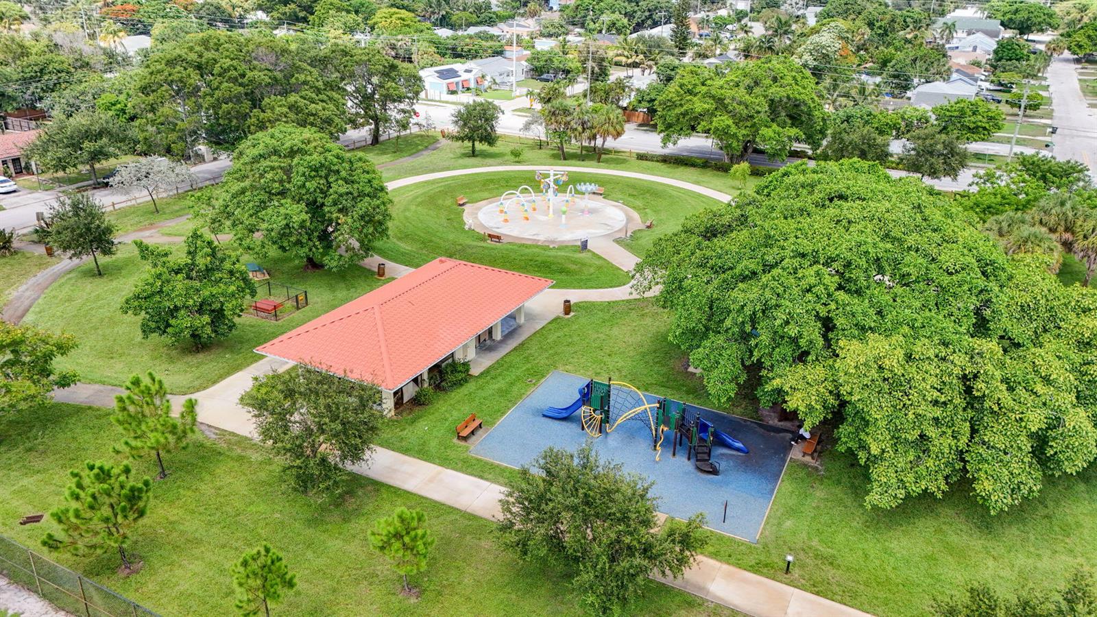 An aerial view of a park featuring a playground, splash pad, and a covered pavilion — 3400 PARKER Avenue, West Palm Beach FL 33405, WEST PALM BEACH, FL