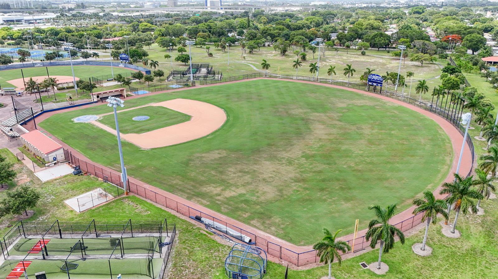 An aerial view of a baseball field with a dirt infield and surrounding palm trees — 3400 PARKER Avenue, West Palm Beach FL 33405, WEST PALM BEACH, FL