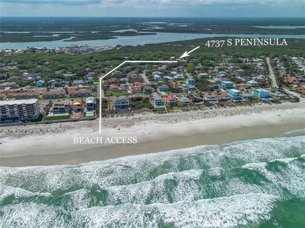 An aerial view shows a coastal neighborhood with a marked path to the beach — 4737 S. PENINSULA DRIVE, PONCE INLET, FL