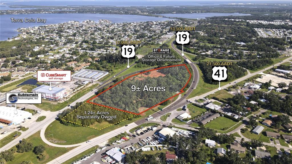 This aerial view shows a 9-acre wooded plot of land located between two highways — 3945 US-41 N, PALMETTO, FL