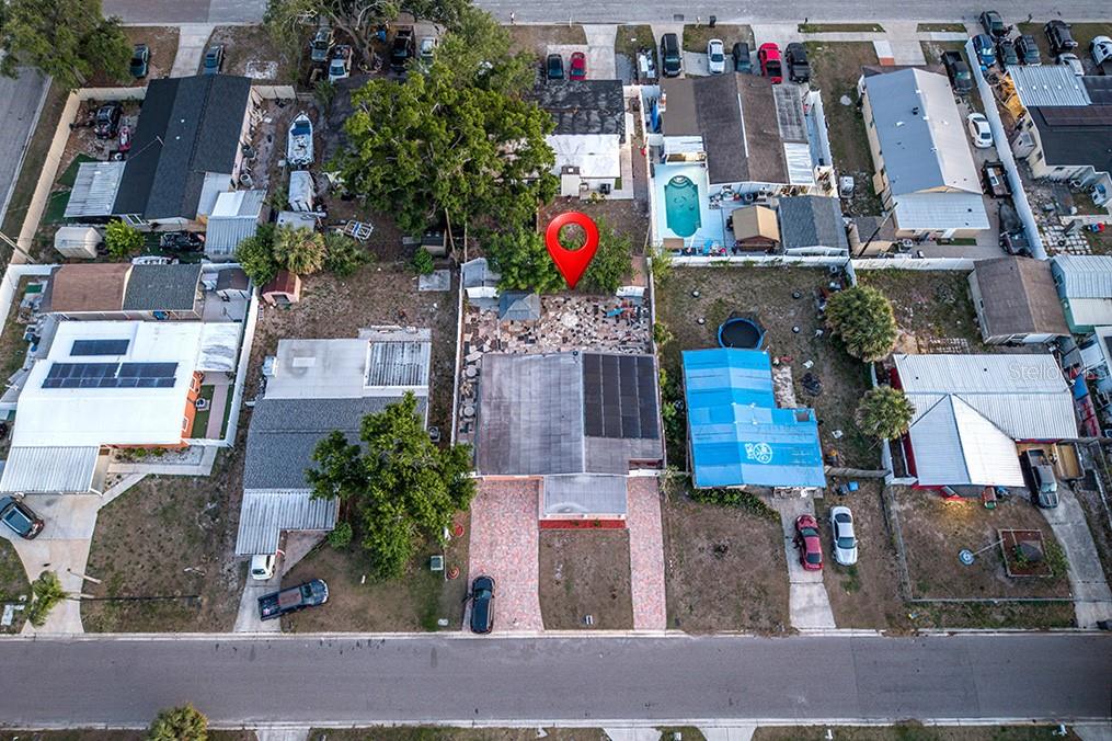 An aerial view shows a residential neighborhood with a house marked by a red pin — 6506 SALINE STREET, TAMPA, FL