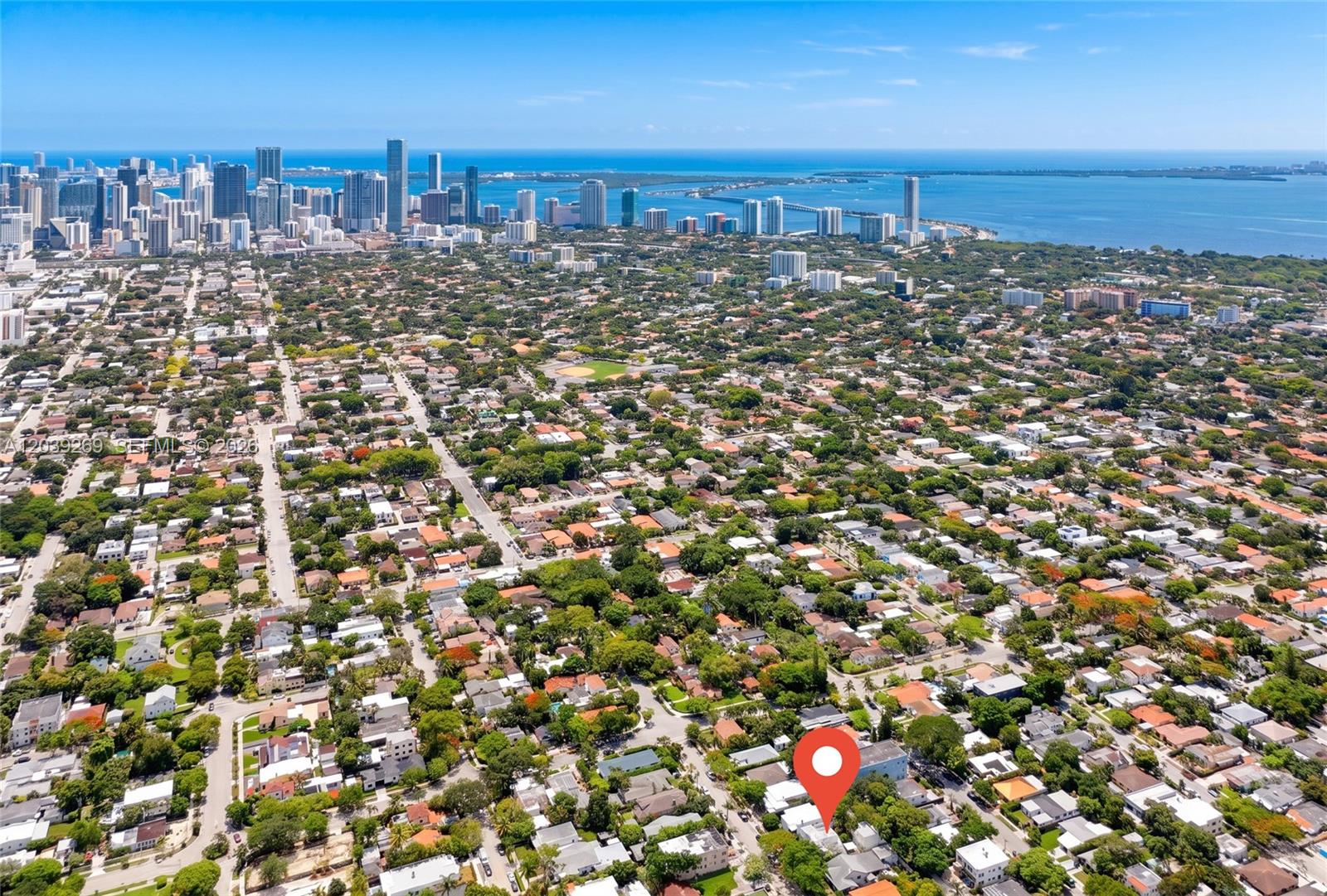 An aerial view shows a residential neighborhood with a red location pin on a house — 1642 SW 12th St, Miami FL 33135, MIAMI, FL