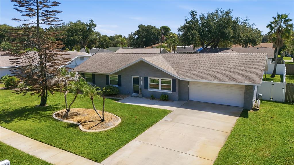 An aerial view of a single-story gray brick house with a two-car garage and lawn — 636 DEVON STREET, PORT ORANGE, FL