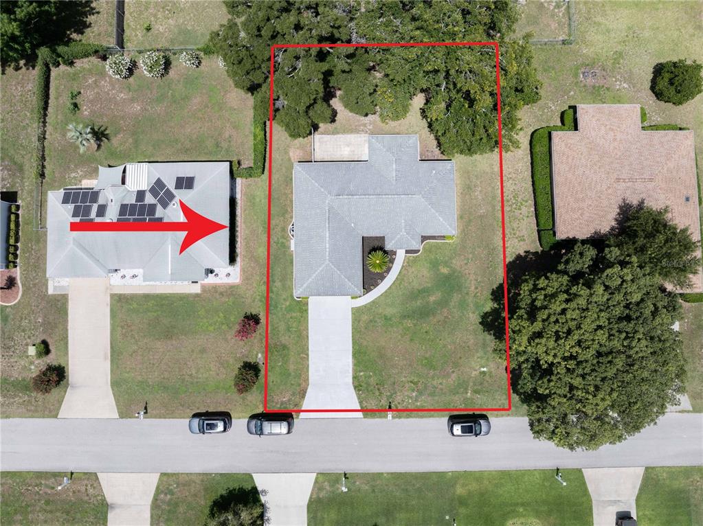 An aerial view of a single-story house with a gray roof and white exterior — 10280 SW 62ND TERRACE ROAD, OCALA, FL