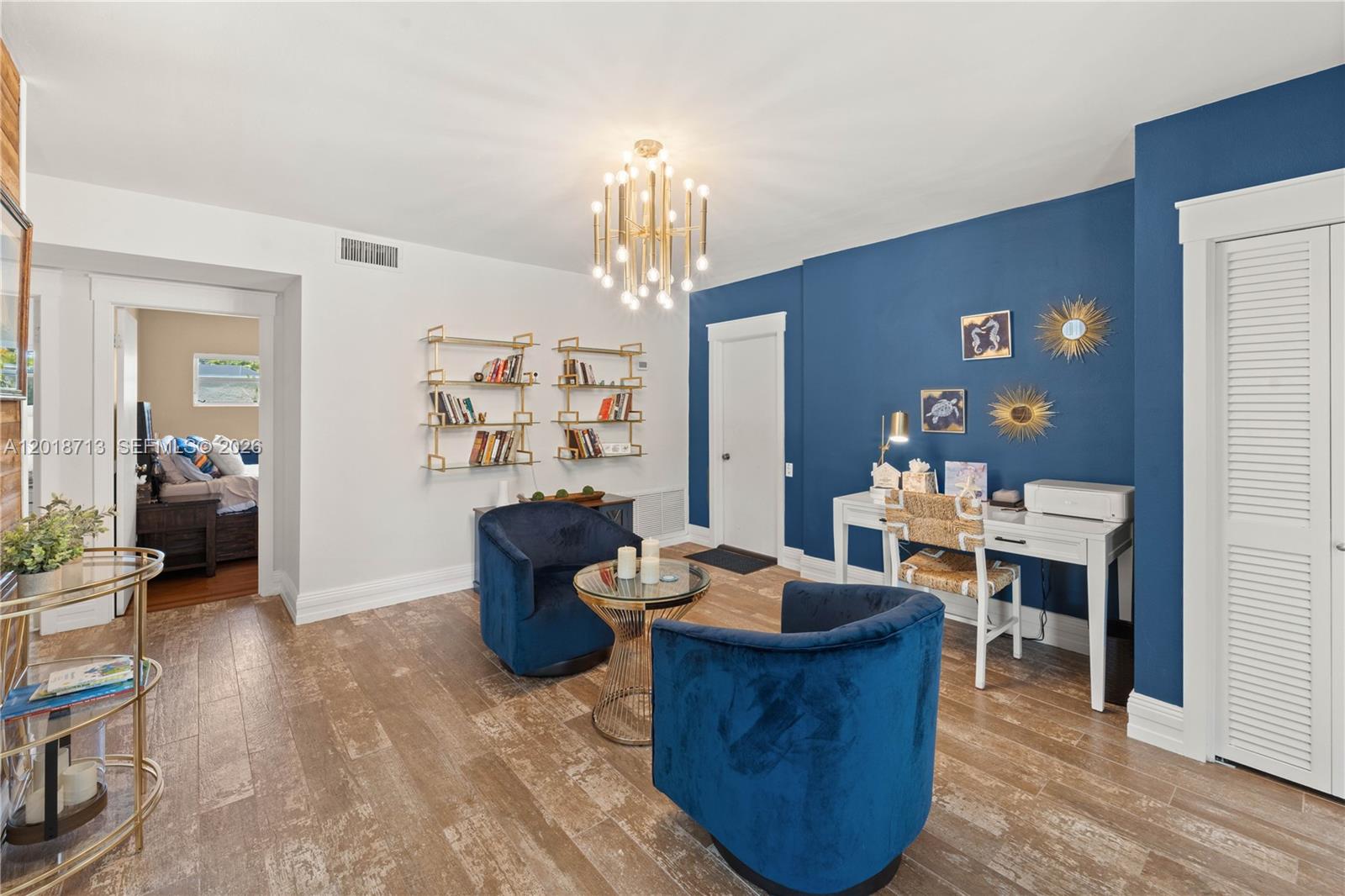 A room features blue accent walls, two velvet chairs, a desk, and gold shelving — 8380 SW 186 St, Cutler Bay FL 33157, CUTLER BAY, FL