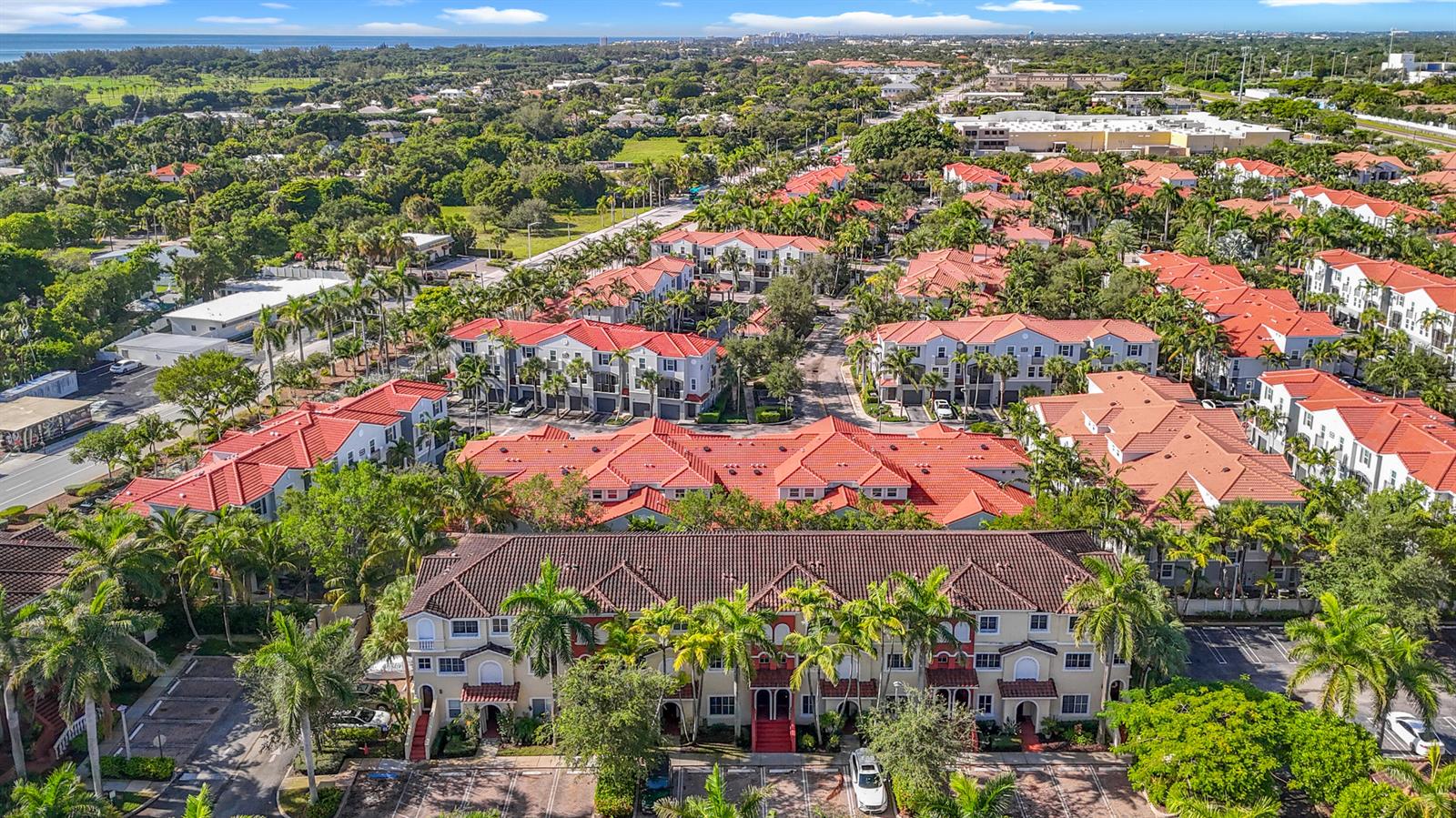 An aerial view shows a residential complex with multiple buildings featuring red tile roofs — 312 Bayfront Drive, Boynton Beach FL 33435, BOYNTON BEACH, FL