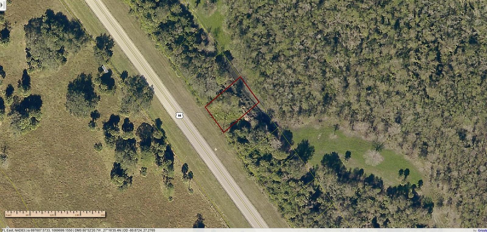 An aerial map shows a rectangular property parcel outlined in red next to a highway — 19216 NW 300th Street, Okeechobee FL 34972, OKEECHOBEE, FL