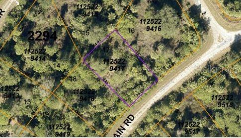 An aerial map view shows a highlighted vacant lot surrounded by trees and a road — KAMAIN ROAD, NORTH PORT, FL