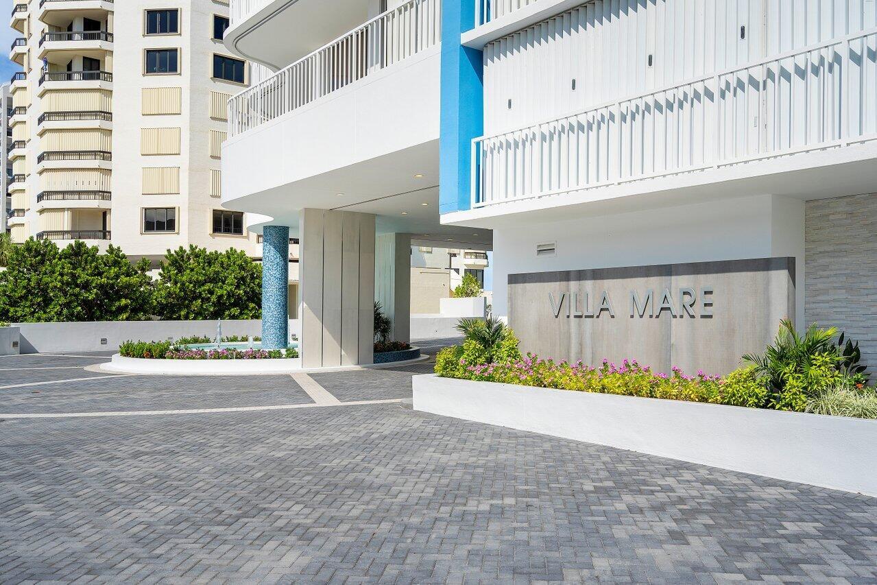 The exterior entrance of a building features a paved driveway, landscaping, and a Villa Mare sign — 3211 S Ocean Boulevard # 903, Highland Beach FL 33487, HIGHLAND BEACH, FL