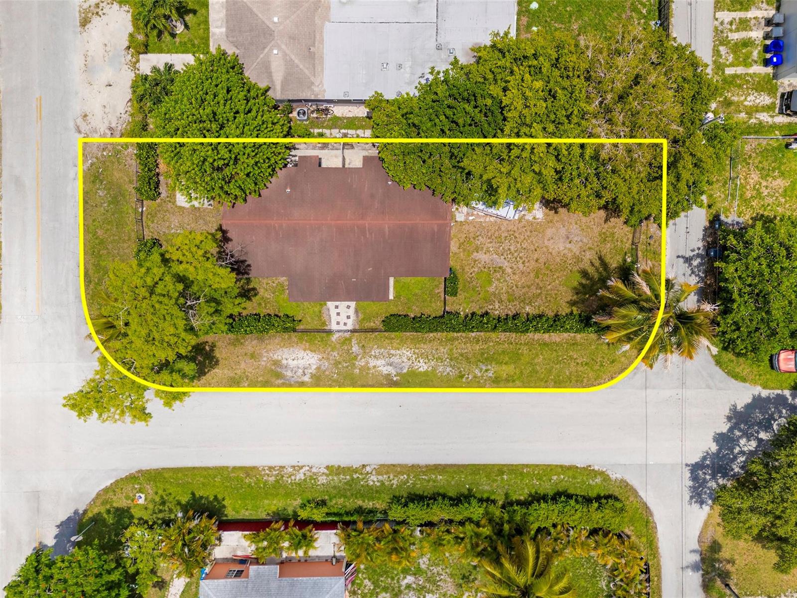 An aerial view shows a single-story house with a brown roof on a corner lot — 1923 N 23rd Avenue, Hollywood FL 33020, HOLLYWOOD, FL