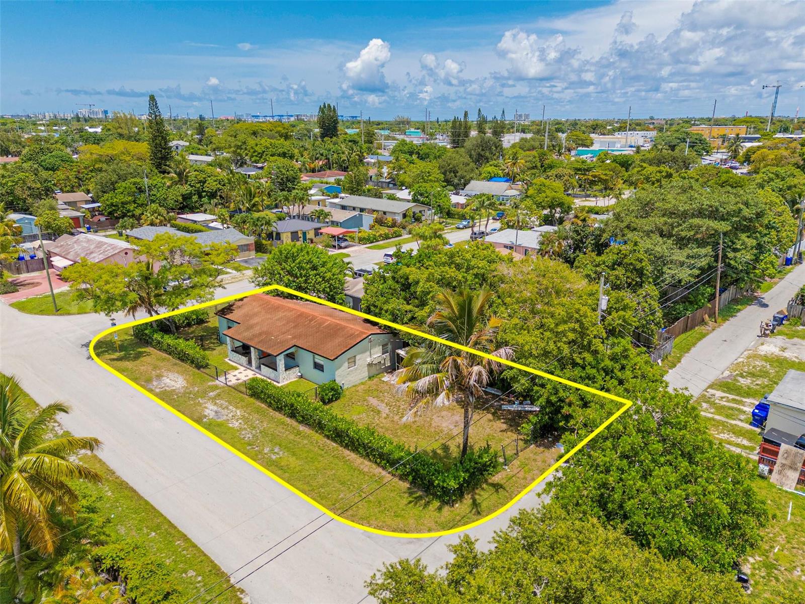An aerial view shows a single-story house with a brown roof on a corner lot — 1923 N 23rd Avenue, Hollywood FL 33020, HOLLYWOOD, FL