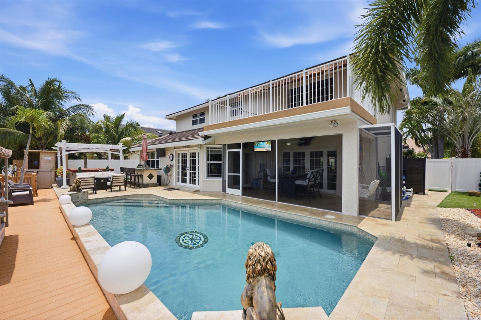 A two-story house with a swimming pool, a wooden deck, and a screened-in patio area — 1548 SW 5th Avenue, Boca Raton FL 33432, BOCA RATON, FL