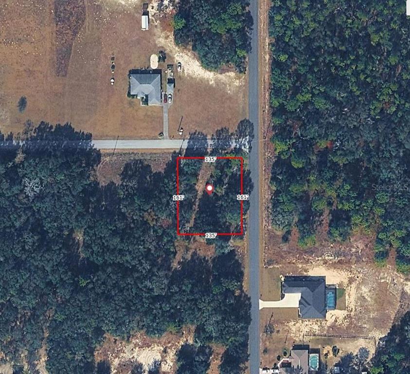 An aerial map view shows a rectangular plot of land with dimensions labeled 135' by 161 — SW NORTH BEACH ROAD UNIT 104, DUNNELLON, FL