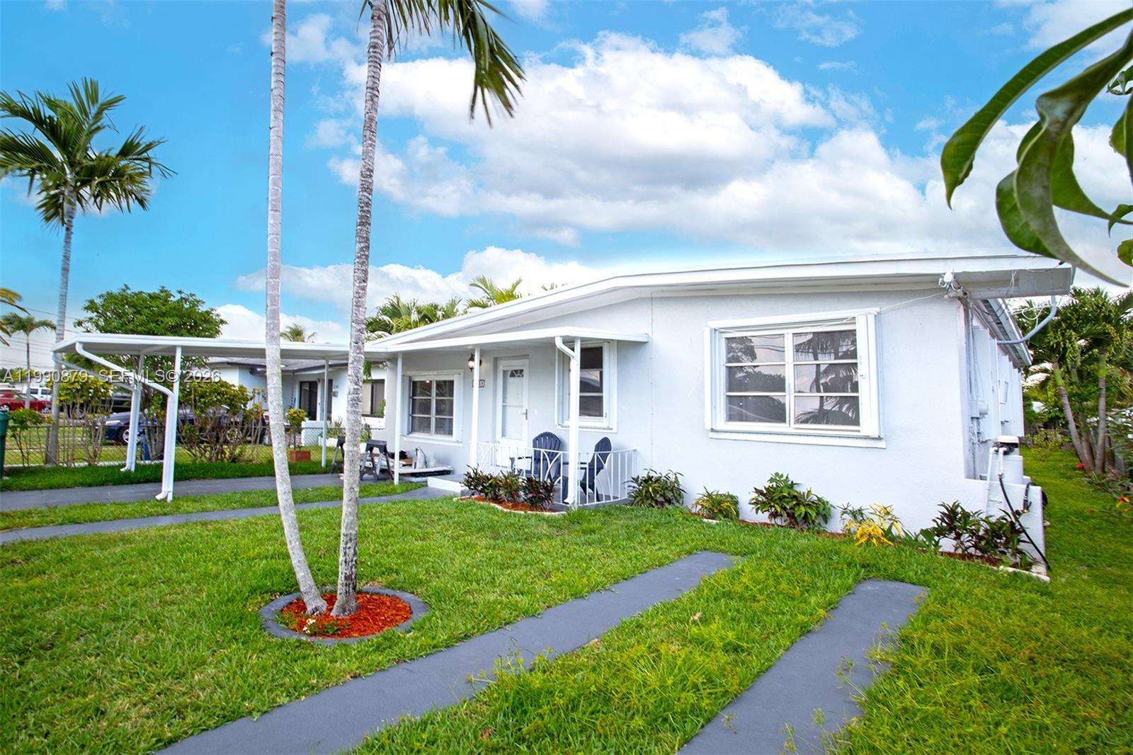 A single-story white house with a carport and a grassy front yard — 6339 SW 32nd St, Miami FL 33155, MIAMI, FL