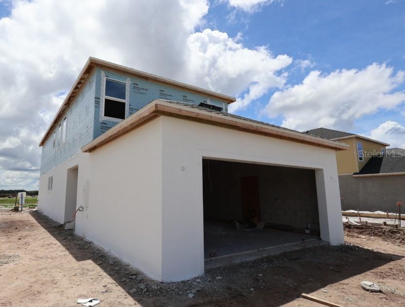 This is a floor plan of the first level of a home with a garage — 2851 CRIMSON CAP STREET, ODESSA, FL