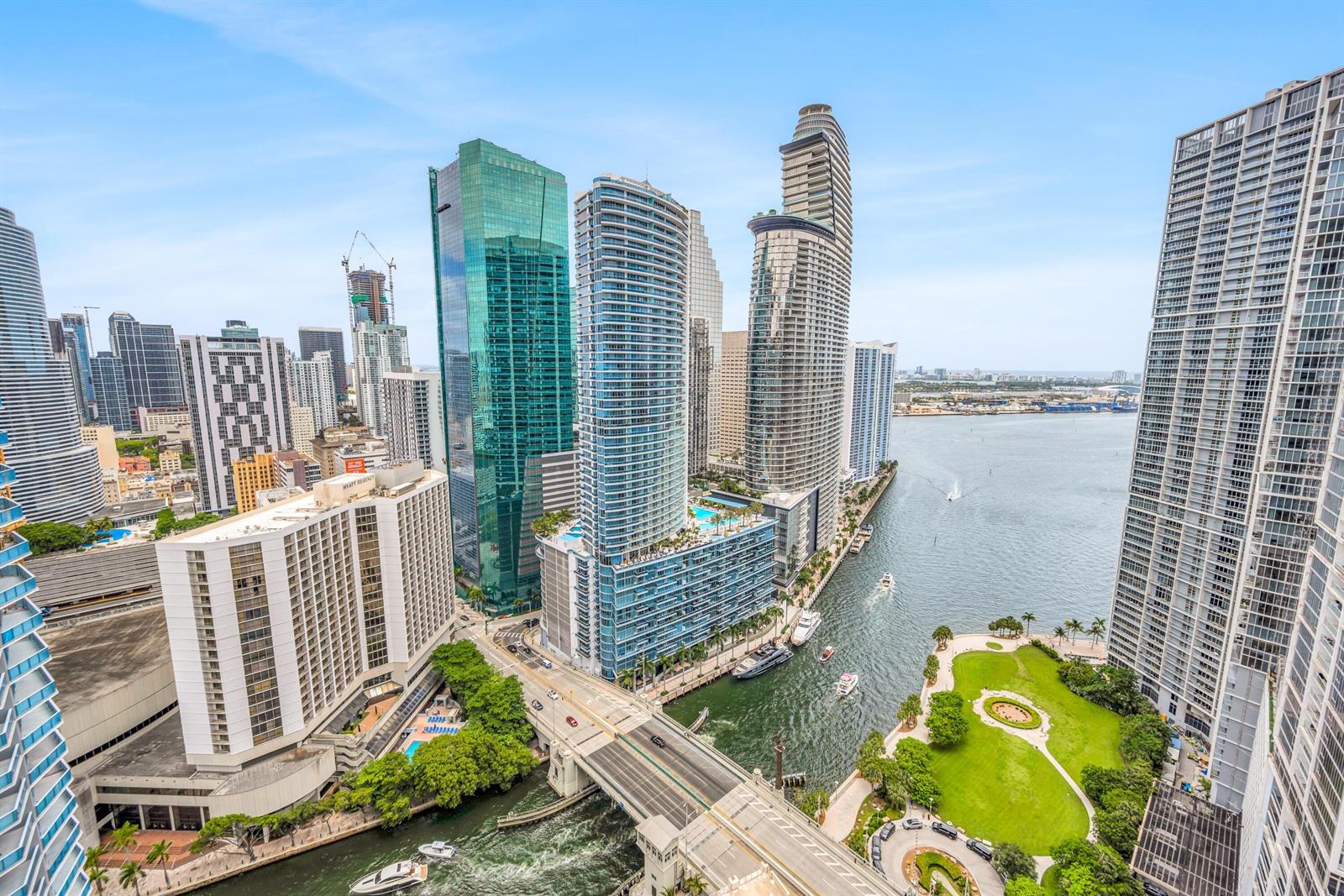 An elevated view of a Miami waterfront cityscape featuring high-rise buildings, a bridge, and a park — 77 SE 5th Street # 2014, Miami FL 33131, MIAMI, FL