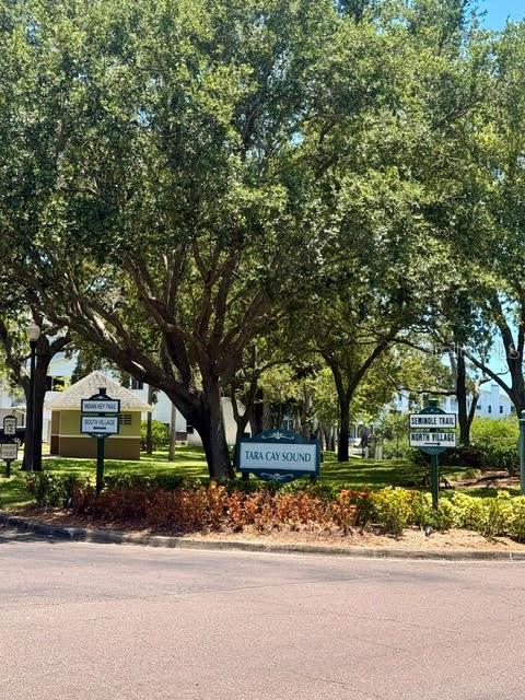 A street-level view shows the Tara Cay Sound community entrance with directional signs and trees — 9978 INDIAN KEY TRAIL # 6 TRAIL, SEMINOLE, FL