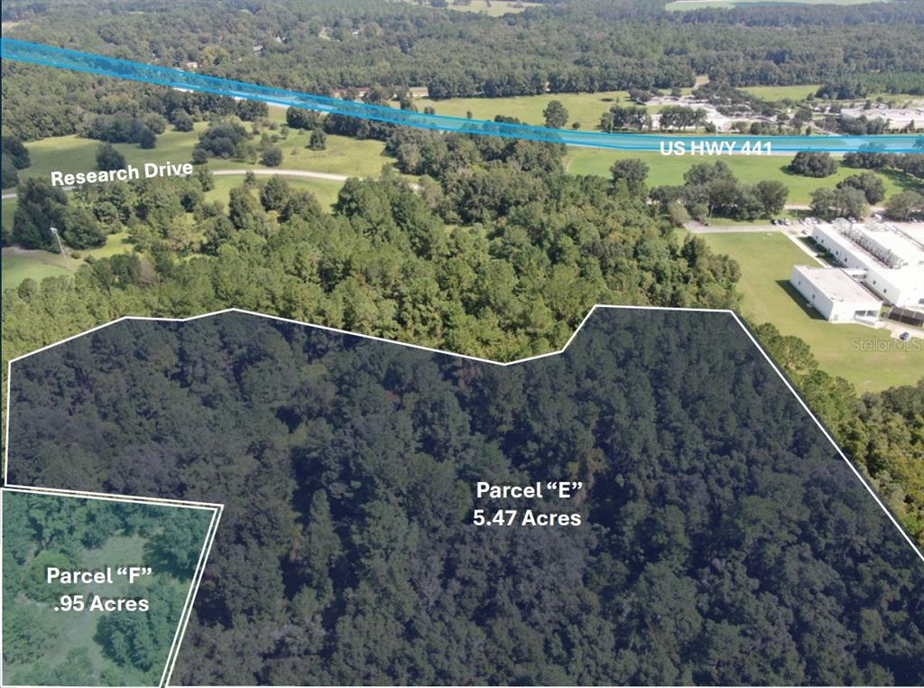 An aerial view shows two wooded land parcels labeled E and F near a highway — TECHNOLOGY AVENUE, ALACHUA, FL