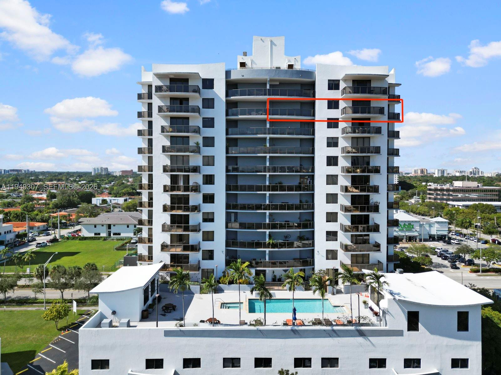 An exterior view of a high-rise apartment building with a red box highlighting a balcony — 2301 SW 27th Ave # 1403, Miami FL 33145, MIAMI, FL